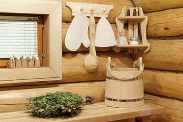 Fototapeta na wymiar Sauna accessories by the window in the bathhouse. 