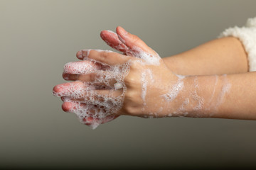Fototapeta premium Washing hands with soap against disease infection versus flu or infulenza
