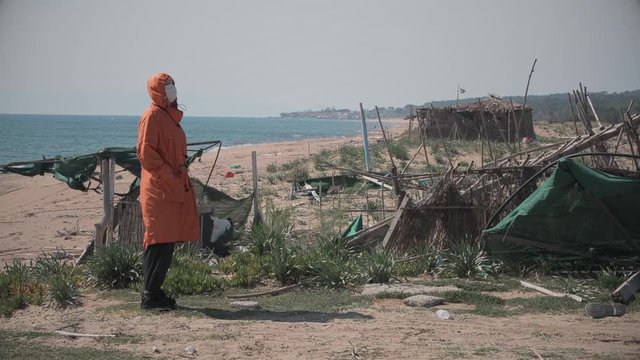 Lonely girl on the beach during coronavirus quarantine in Greece