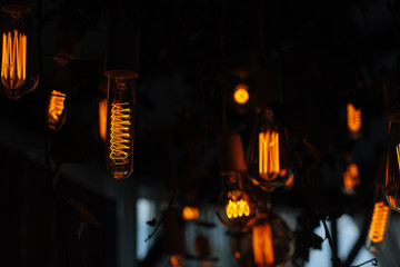   garland of a light bulbs on  background. festive background  for wedding or birthday party closeup with space for text