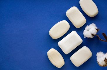 White soap bar on a dark blue background