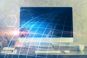 Multi exposure of table with computer and world map hologram. International data network concept.