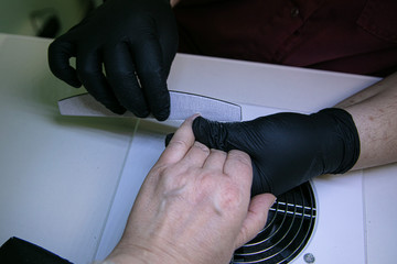 Patient on a manicure procedure. Spa