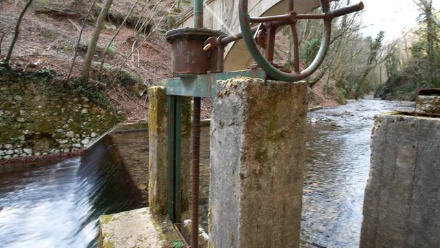 waterfalla and building of the fascist era. Aqueduct with a fascist bridge over the Calore river in Montella, Avellino, Campania, Italy