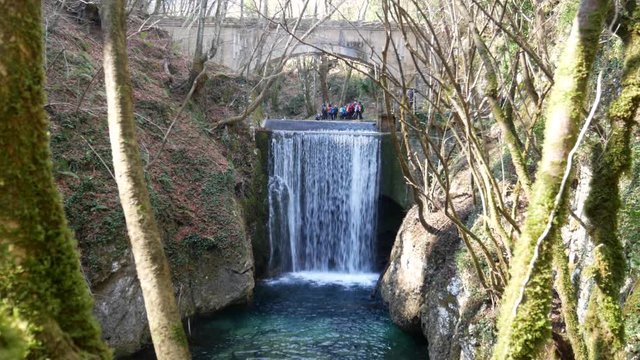 waterfall and building of the fascist era. Aqueduct with a fascist bridge over the Calore river in Montella, Avellino, Campania, Italy