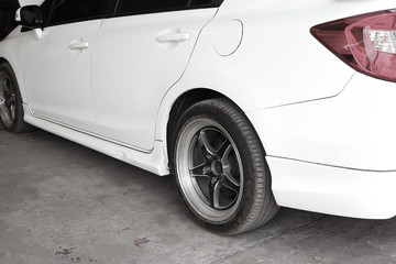 The mechanic is checking the engine.