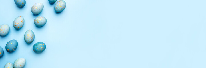 Easter frame of eggs painted in blue color. Flat lay, top view. Copy space for text.