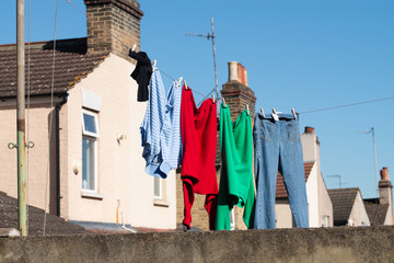Clothes drying on a clothes line in typical garden in London, England