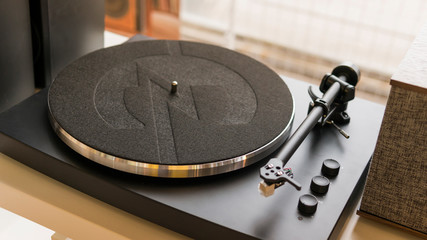 Close-up of modern turntable vinyl record player. Needle of a vinyl record