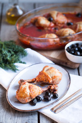 Chicken Cacciatore braised with wine, olives and tomatoes, traditional Italian dish.