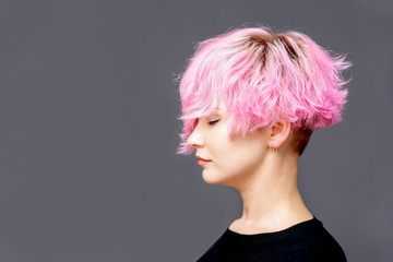 Woman with pink hairstyle.
