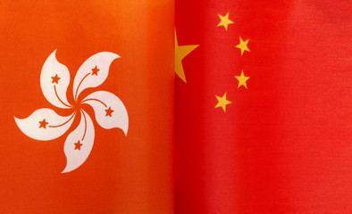 fragments of flags of the Hong Kong Special administrative region and China close up