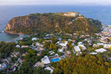 Aerial Drone photo of the beautiful island of ischia with blue sea and skies  in Ischia, Italy
