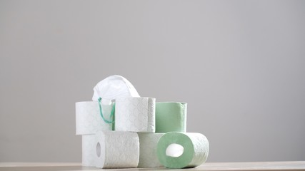 Many tubes of toilet paper. Stack of toilet paper rolls against a gray background. Coronavirus or COVID-19. Pandemic worldwide, panic.Recycling. Epidemic situation. 