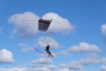 A parachute is flying in the sky.