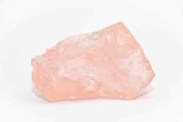 Big piece of rose quartz SiO2 unpolished with uneven shiny surfaces
