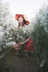 Portrait young woman is in flower white cutter garden.