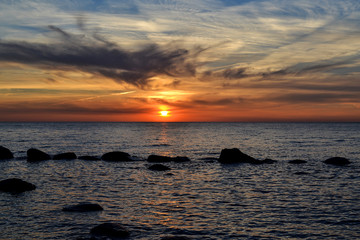 Fototapeta na wymiar Colourful and relaxing sunset at the Baltic sea