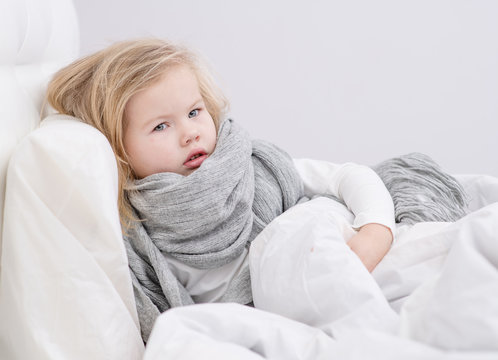 Sad Sick Little Girl Lying In The Bed