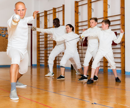 Male training at fencing workout