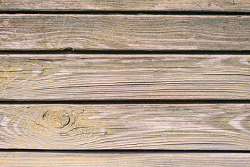 Fototapeta premium Old wooden plank background. Peeling, faded purple paint on the old boards. Copying space