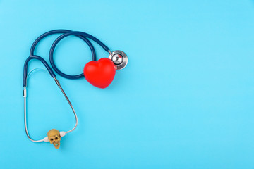 Doctor's Day concept, flat lay top view, stethoscope with red hearts diagnosis of heart disease