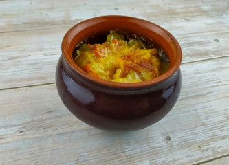 Stewed vegetables with mushrooms in a pot