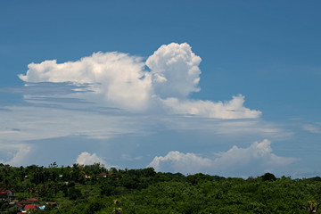 Clouds shaped people in the blue sky