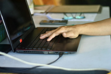 Hands of people are working at home with computer laptop for protect your life from coronavirus and reduce to spread of virus Covid-19