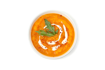 Pumpkin cream soup isolated on white background