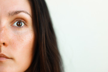 close up portrait of a woman half face