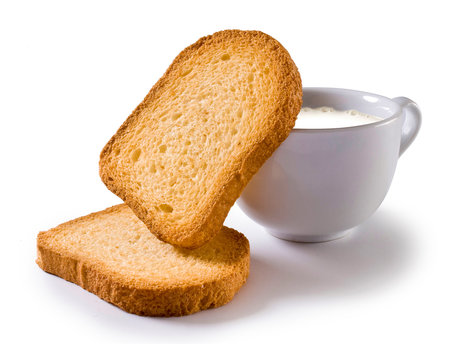 Breakfast set isolated on white, cup of milk and two rusks