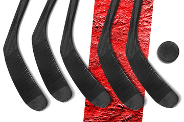 Five hockey sticks and puck on a white background with a red line