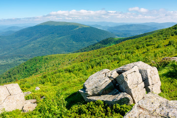 beautiful summer landscape in mountains. green grassy meadow on the hill side. view in to the...