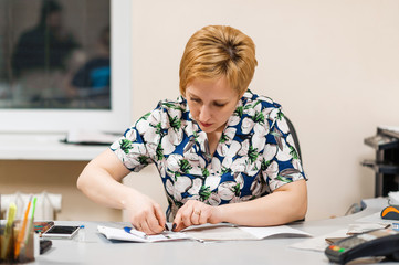 Veterinarian fills out documentation at the desk