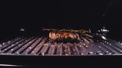 Delicious juicy meat steak cooking on grill. Aged prime rare roast grilling tenderloin fresh marble...