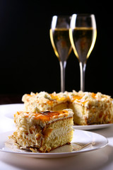 two glasses of champagne with cake