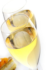 two champagne glasses with rign inside