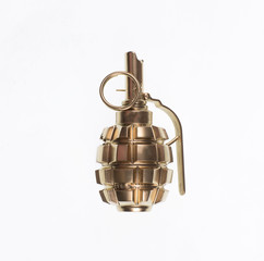 golden combat grenade isolated on a white background