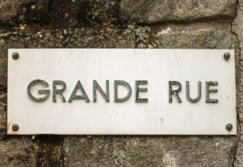 Street sign Grande Rue on a stone wall