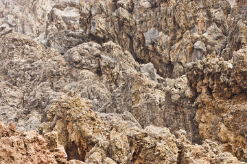 Madeira volcanic rocks. Porto Moniz geology texture. Lava stone cliff. Porous magma structure pattern.