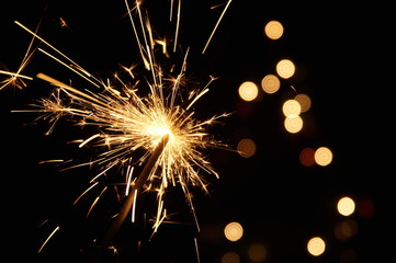 burning sparkler firework. Happy new year and Merry christmas concept. Happy holidays. Abstract...