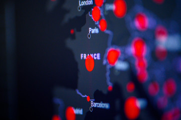 France. Coronavirus COVID-19 global cases Map. Red Dot showing the number of infected. Johns Hopkins University map on monitor display.