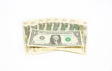 A lot of Russian rubles and dollars on a white isolated background. The problem of the ruble...