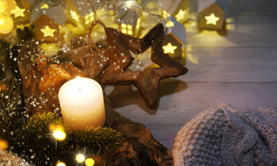 Cosy and soft winter background, knitted sweater and lights