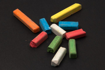 crayons on a dark surface