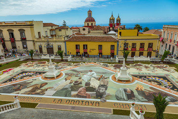 la Orotava, Tenerife, Spain - June 27, 2019. Beautiful flower carpets in La Orotava during Corpus Christi. Famous religious event and competition of folk art. Warm summer evening and joyful visitors