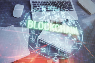 Cryptocurrency hologram over hands taking notes background. Concept of blockchain. Multi exposure