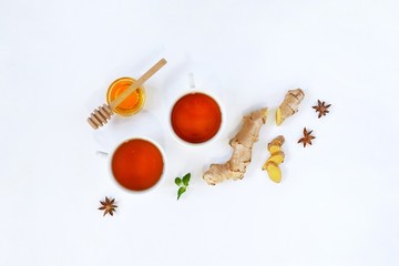 Ingredients for herbal ginger tea with honey, star anise and anise. Healthy food detox concept. Flat lay with space for text. Top view.