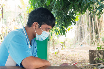 asian man wearing protective mask 